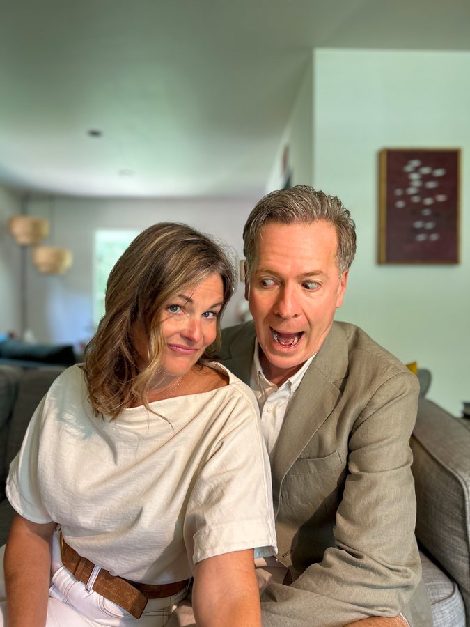 Eric and Julia goofing on the couch